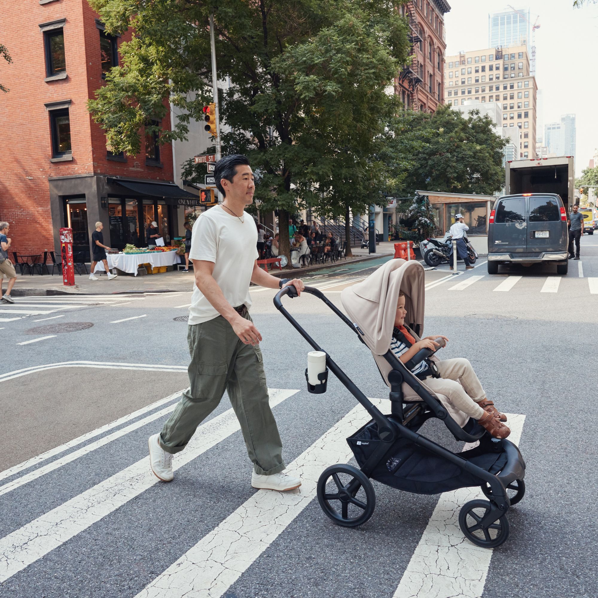 Dad pushes Bugaboo Kangaroo Stroller with his toddler son 