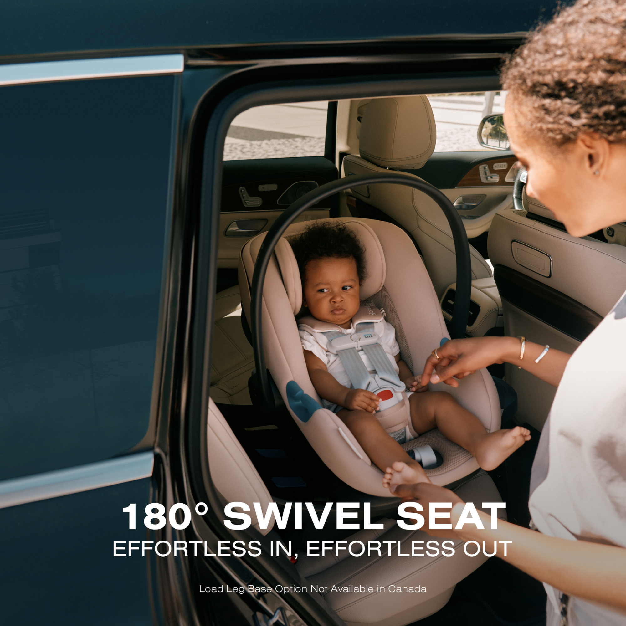 Cybex Aton G swivel infant car seat in rotation mode with baby seated comfortably while mom stands beside, highlighting easy access, safety, and smooth everyday usability. 