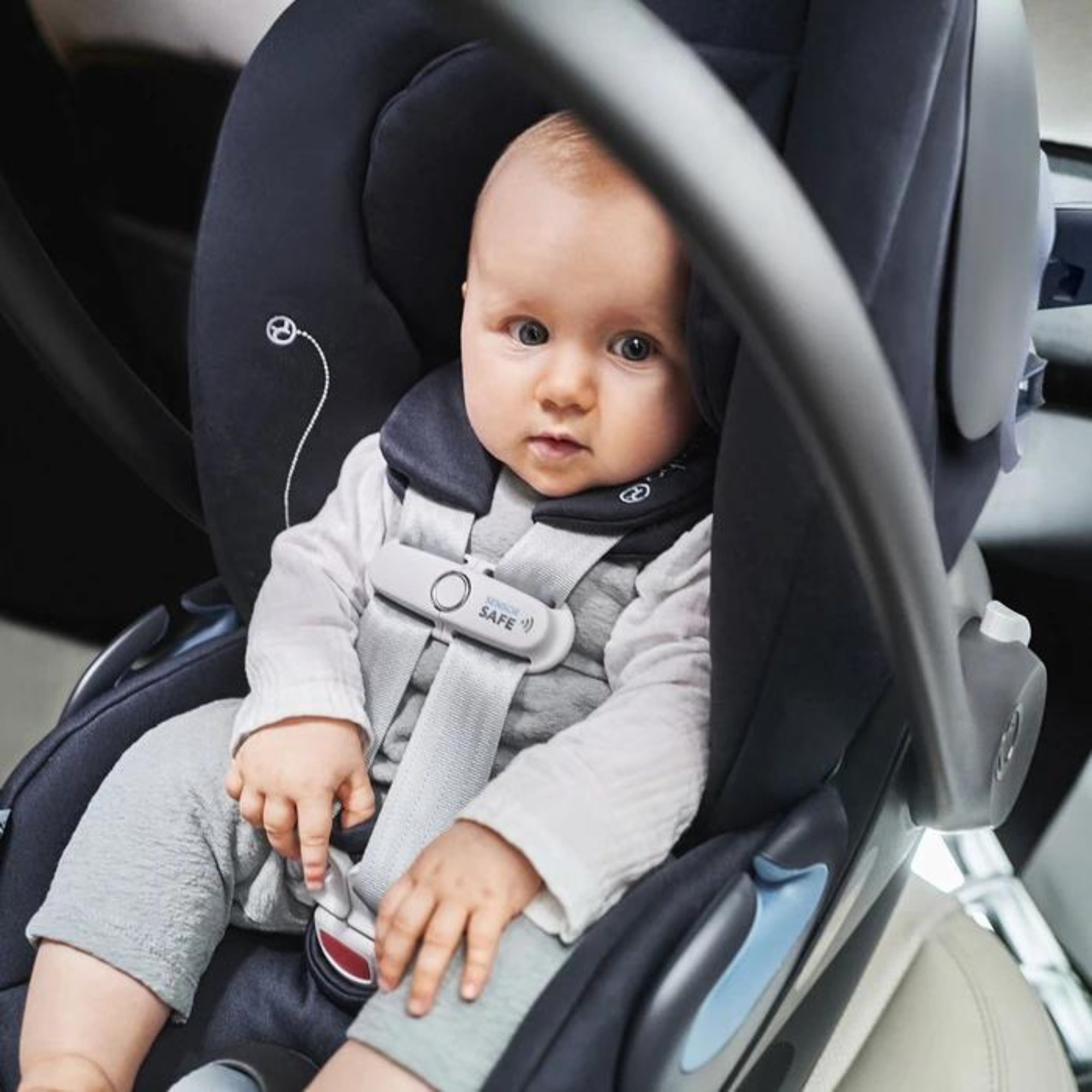 Baby sitting comfortably in the Cybex Cloud G Lux SensorSafe car seat, supported and secure.