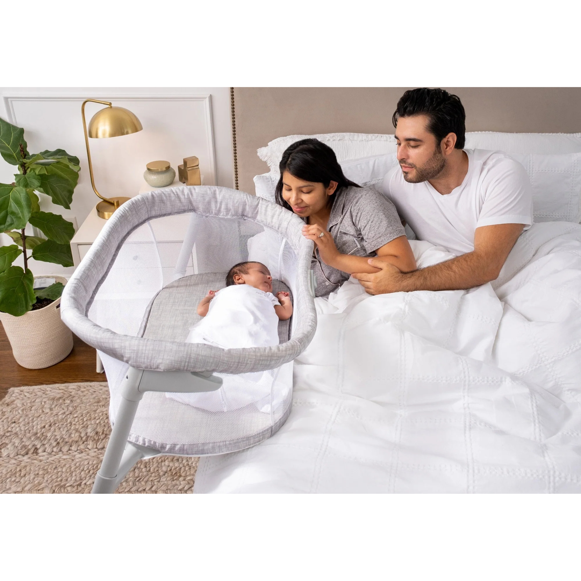 Halo Bassinet beside the parents' bed, keeping baby safe, close, and comfortable for peaceful nighttime care.