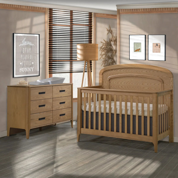 Natart Palo crib and matching dresser in natural ash with a curved panelled headboard, the Quebec-made collection. 