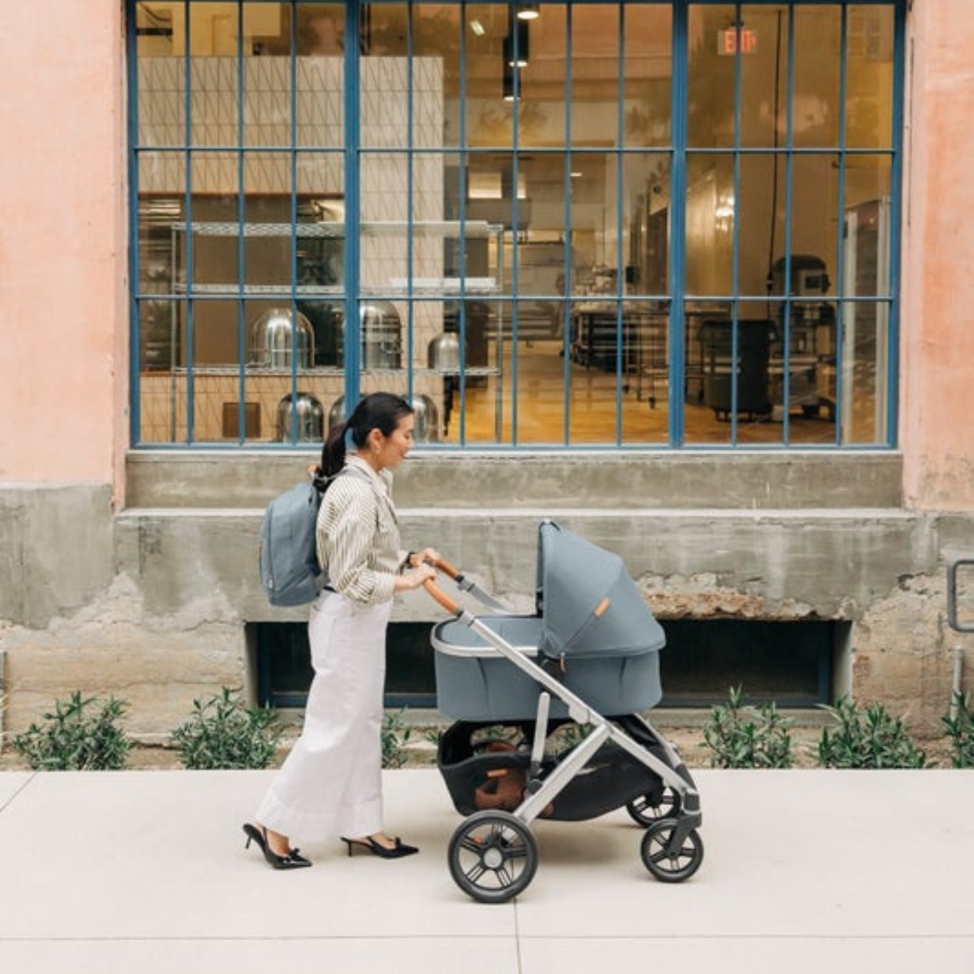 Mother strolls down the street with UPPAbaby Vista V3 and bassinet, giving baby a smooth, cozy, and restful ride. 