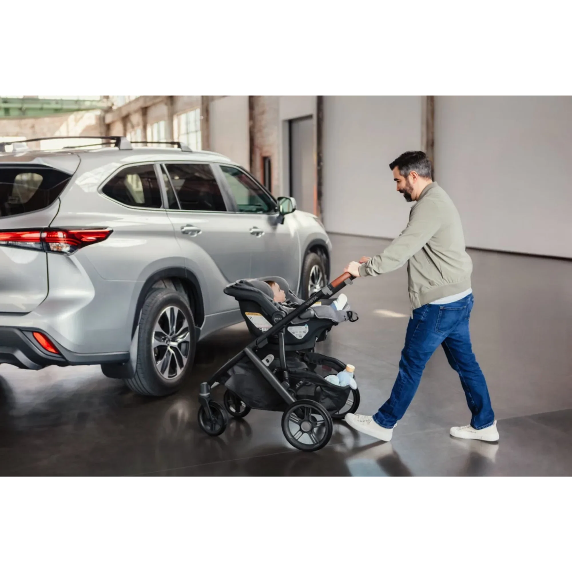 Dad pushing an UPPAbaby stroller with the UPPAbaby Mesa V3 infant car seat, enjoying a smooth family walk
