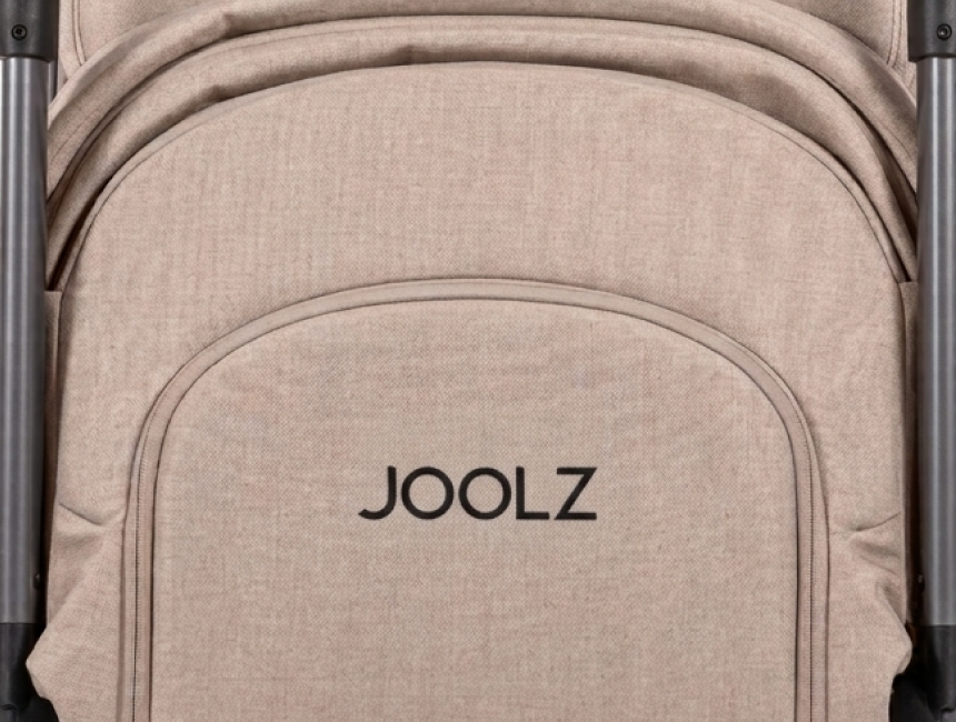 Joolz stroller shown in a lifestyle setting, displaying the full frame and seat unit with the Newborn Pack accessory installed from day one