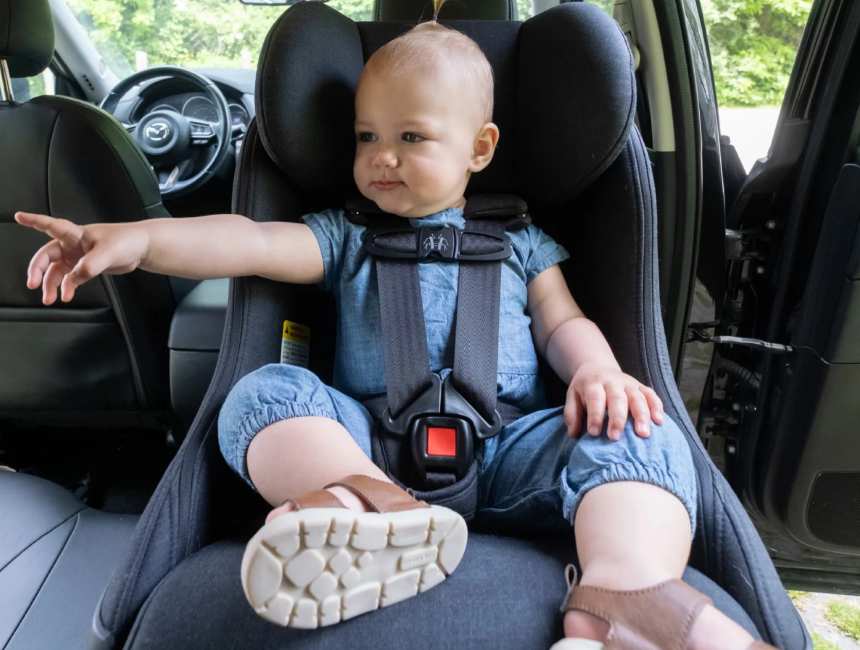 Newborn baby reclined in the Stokke YOYO³ Newborn Pack, demonstrating the lie-flat position and compatibility with the original frame