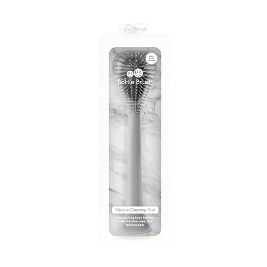 Black silicone baby spoon in clear packaging, featuring soft tip and ergonomic handle designed for gentle feeding and easy grip.