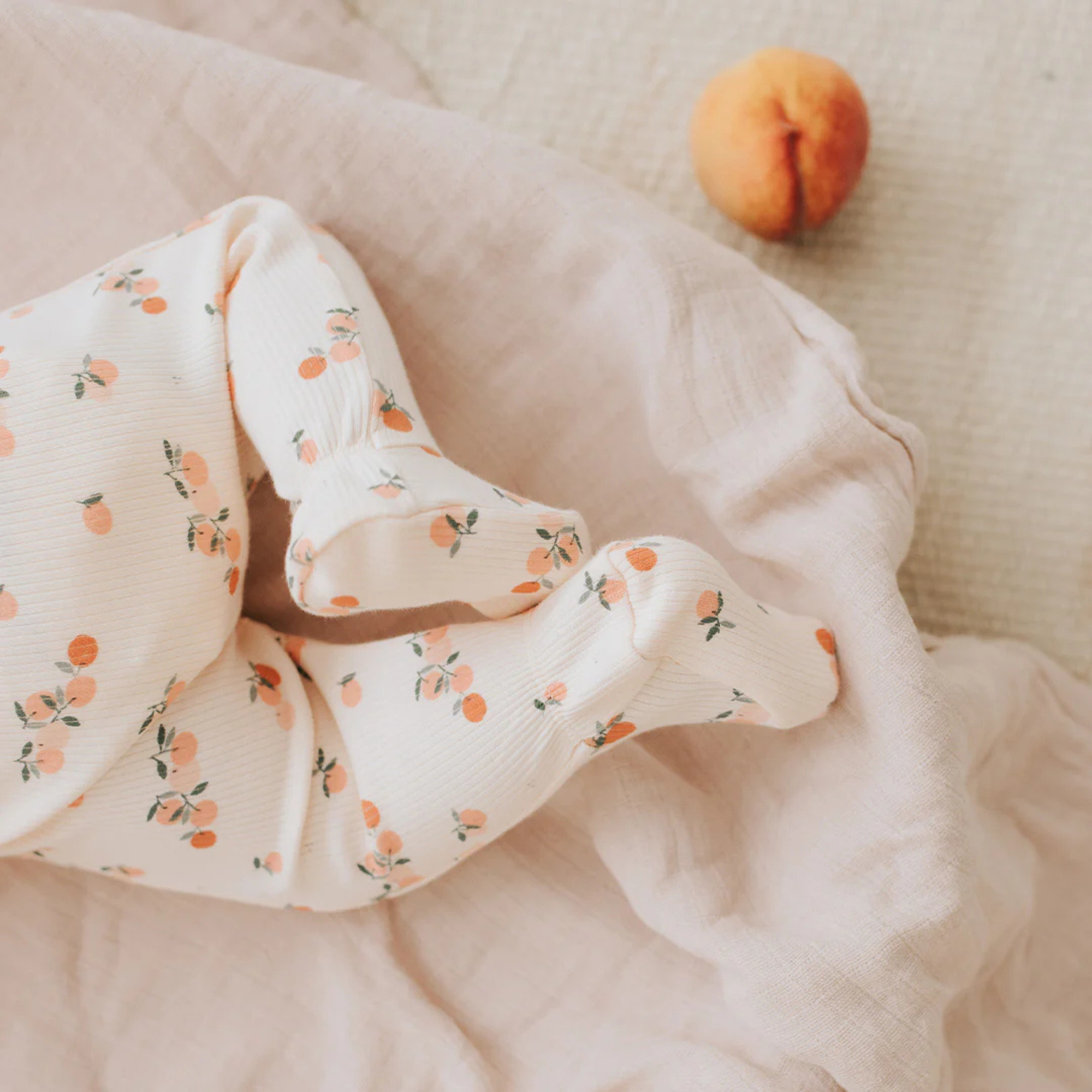 FIRSTS Agrumes Print on Ribbed Barely Coral Sleeper