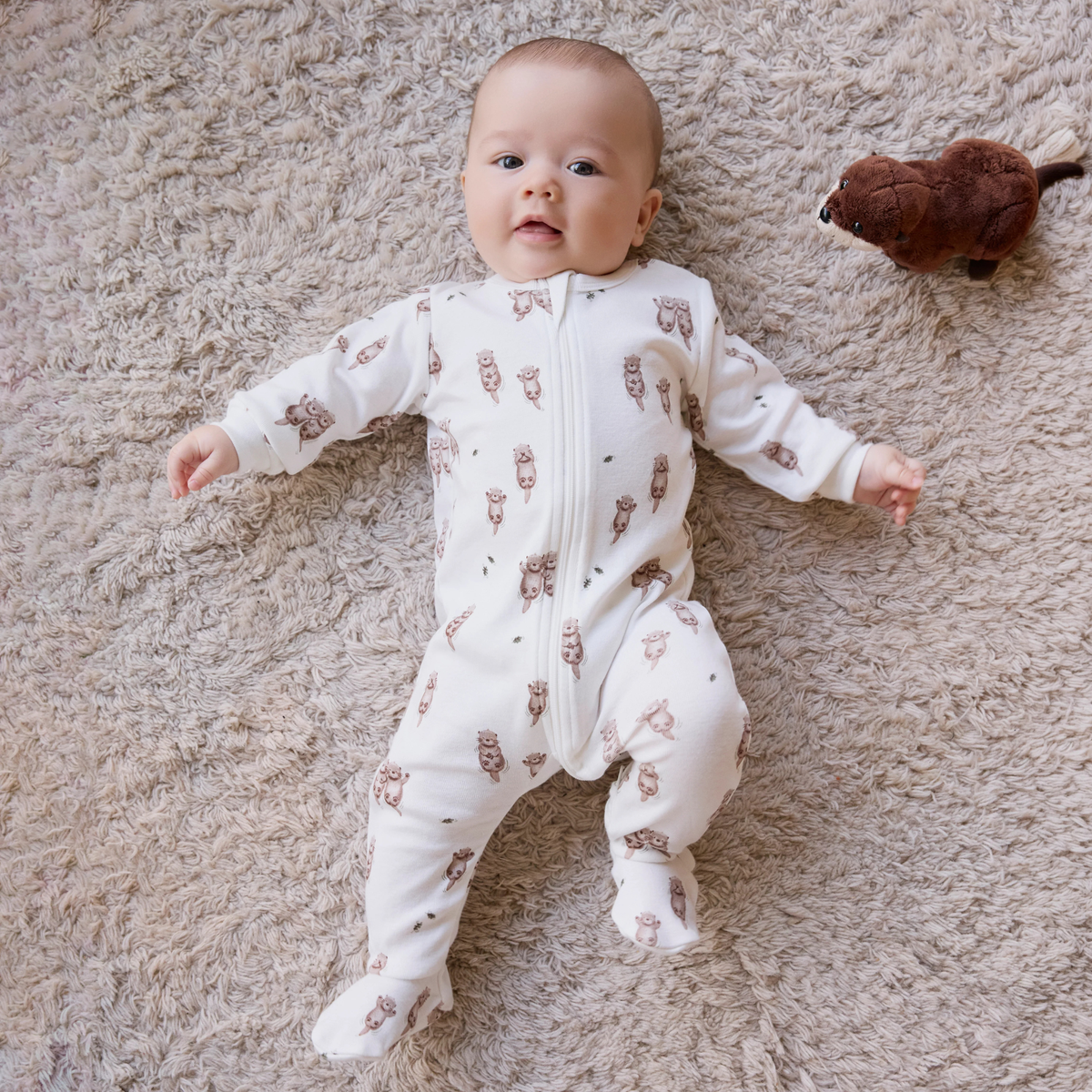 FIRSTS Otter Print on Off-White Footed Sleeper
