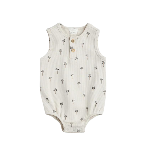 FIRSTS ribbed baby romper in light taupe with palm tree print, sleeveless with button placket and snaps, laid flat to show soft texture.
