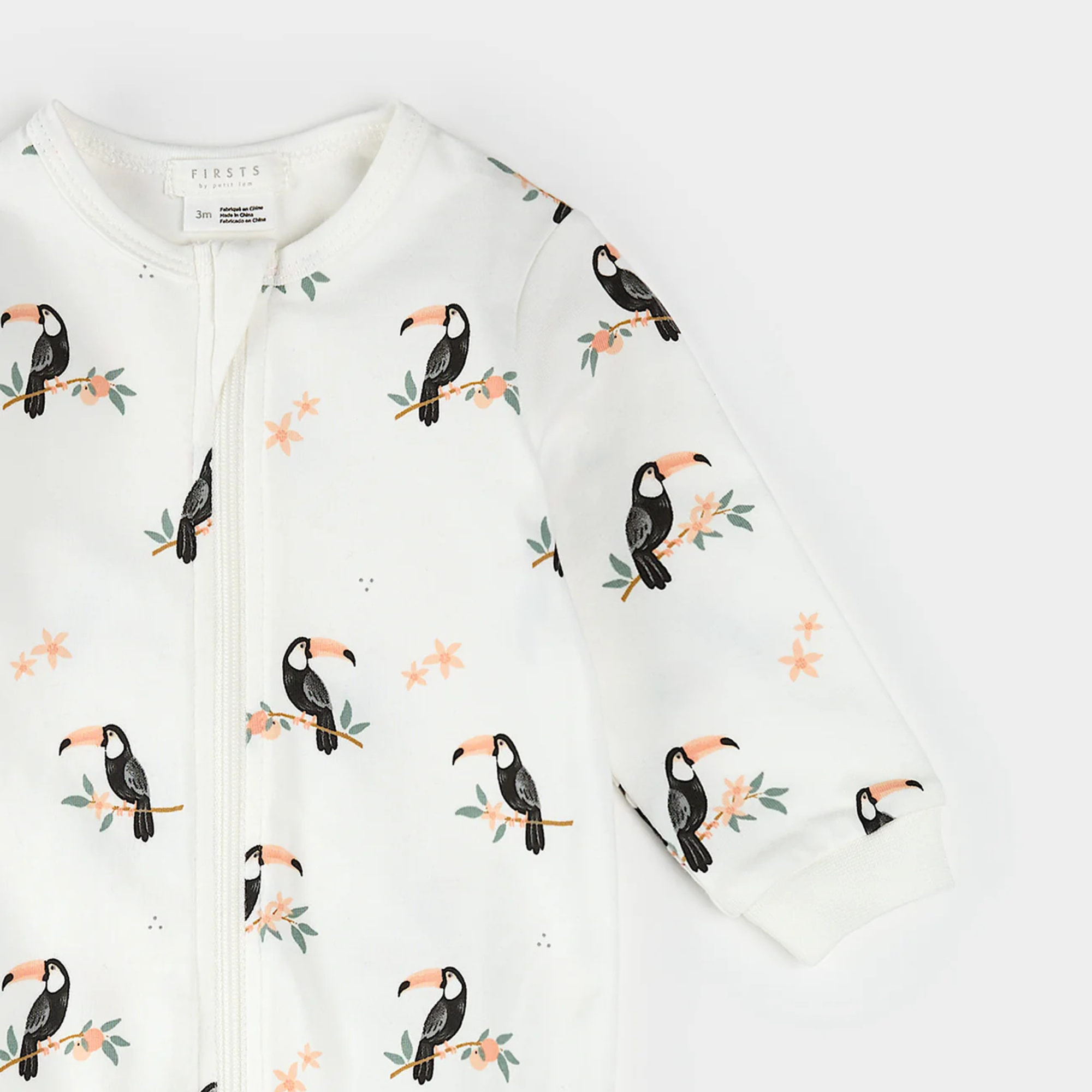 Premier imprimé toucan sur grenouillère blanc cassé 