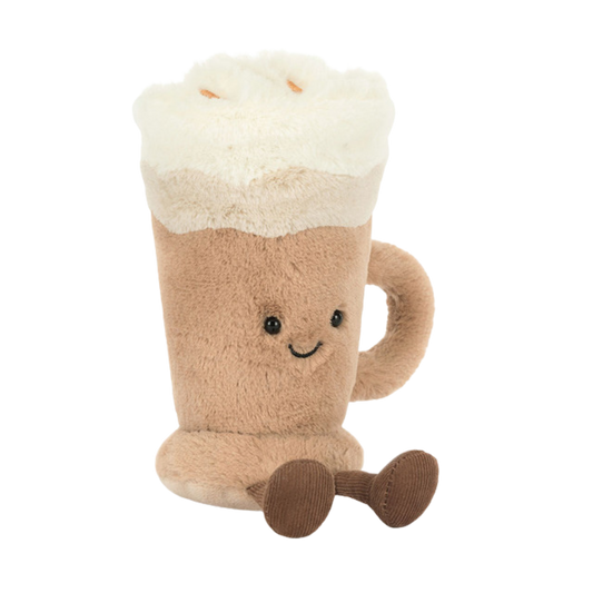 Plush toy shaped like a latte with cream foam top, tan mug body, smiling face, and dangling legs, designed as a soft stuffed gift.