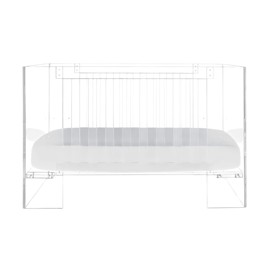 Nursery Works Vetro Crib in clear acrylic with white mattress base, modern see-through design, shown on white background.