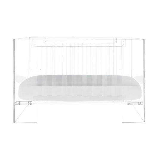Nursery Works Vetro Crib in clear acrylic with white mattress base, modern see-through design, shown on white background.