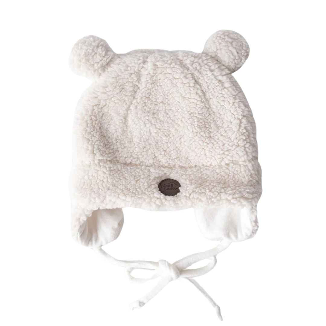 Soft white sherpa baby hat with bear ears and chin ties, designed to keep newborns warm and cozy during cold weather.