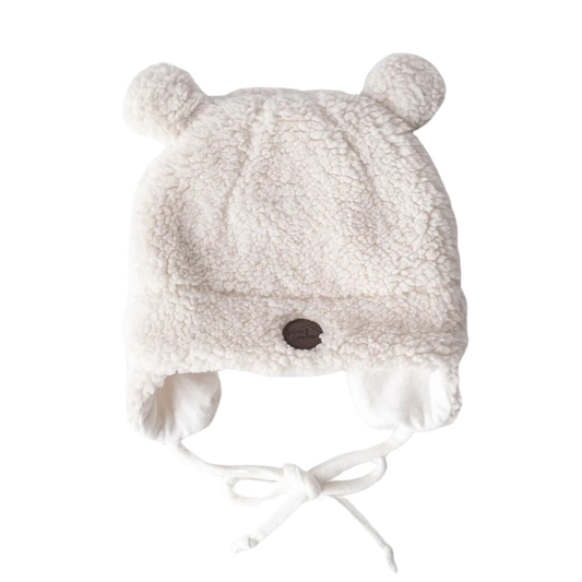Soft white sherpa baby hat with bear ears and chin ties, designed to keep newborns warm and cozy during cold weather.