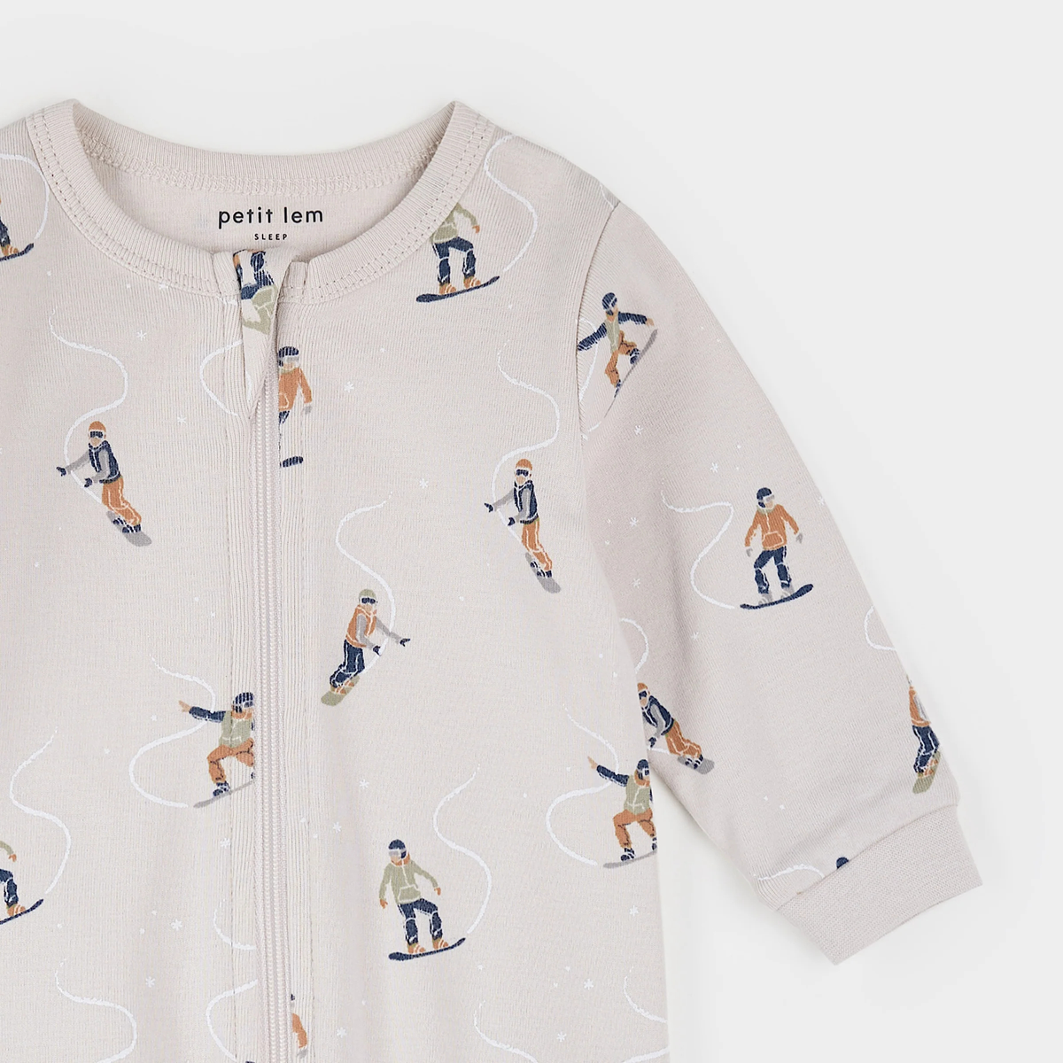 PETIT LEM Snowboarders Print on Beige Footed Sleeper