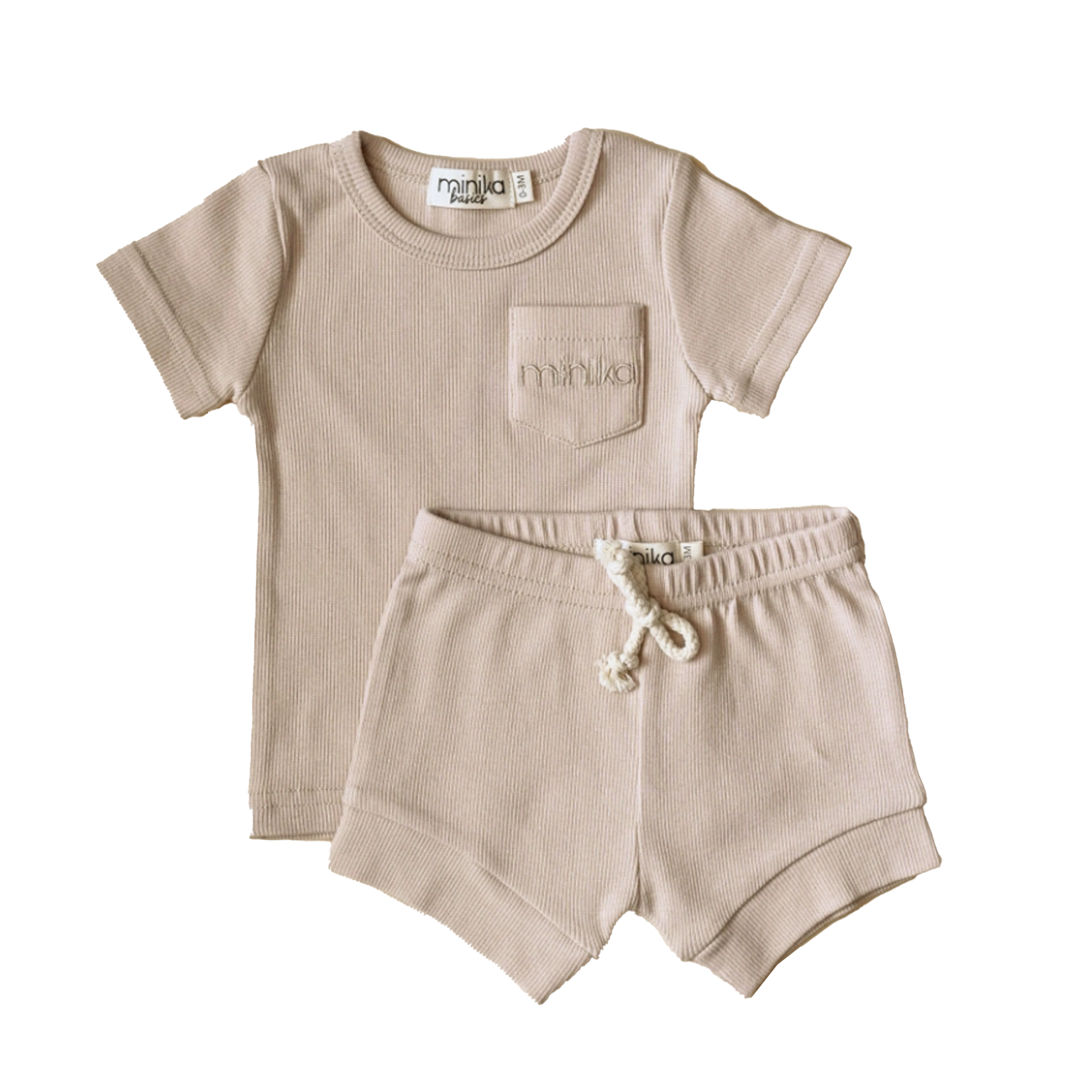 MINIKA cream two-piece set for toddlers featuring a ribbed short-sleeve top with front pocket and drawstring shorts, laid flat.